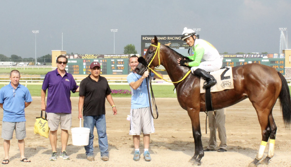 Lady Fog Horn and her team in the winner's circle. Photo courtesy of Indiana Grand. 
